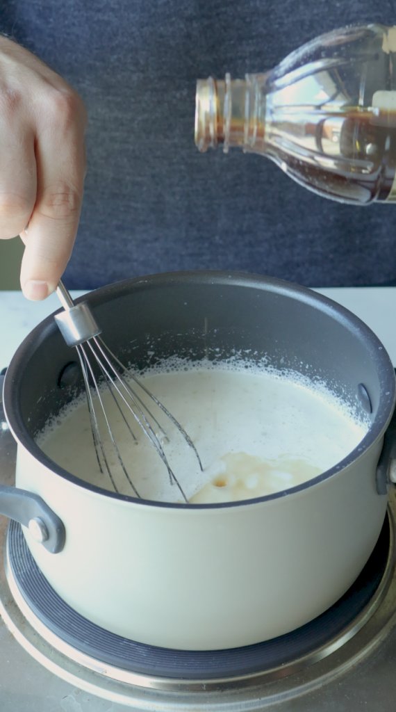 5. Make sure to stir constantly to avoid the milk sticking.
6. Then add sugar, ground cardomom, and the vanilla.